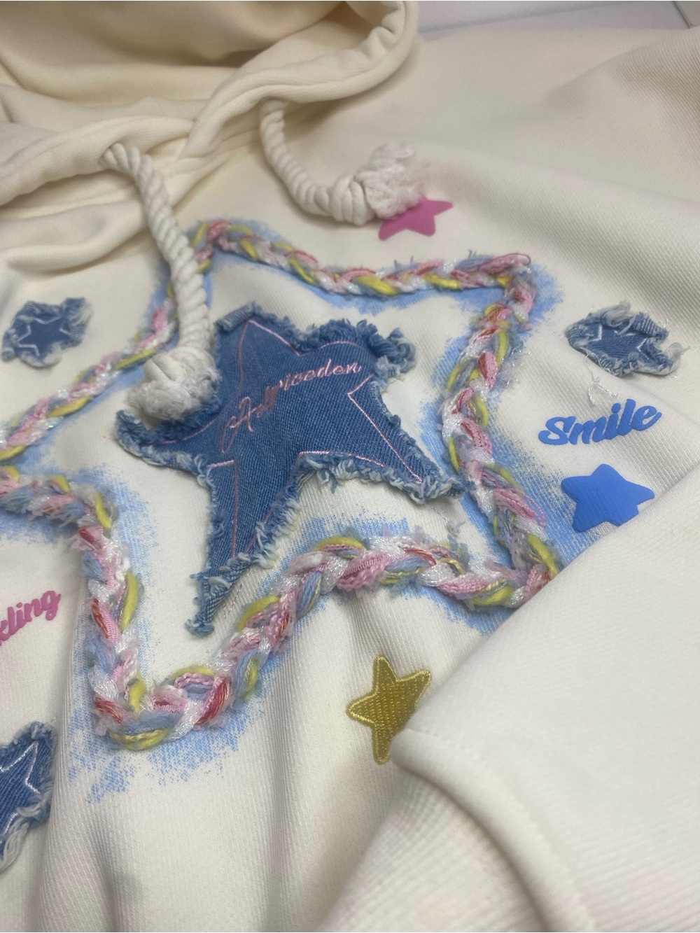 Aelfric Eden Cream Hoodie with Pastel Paint and Braided Detail